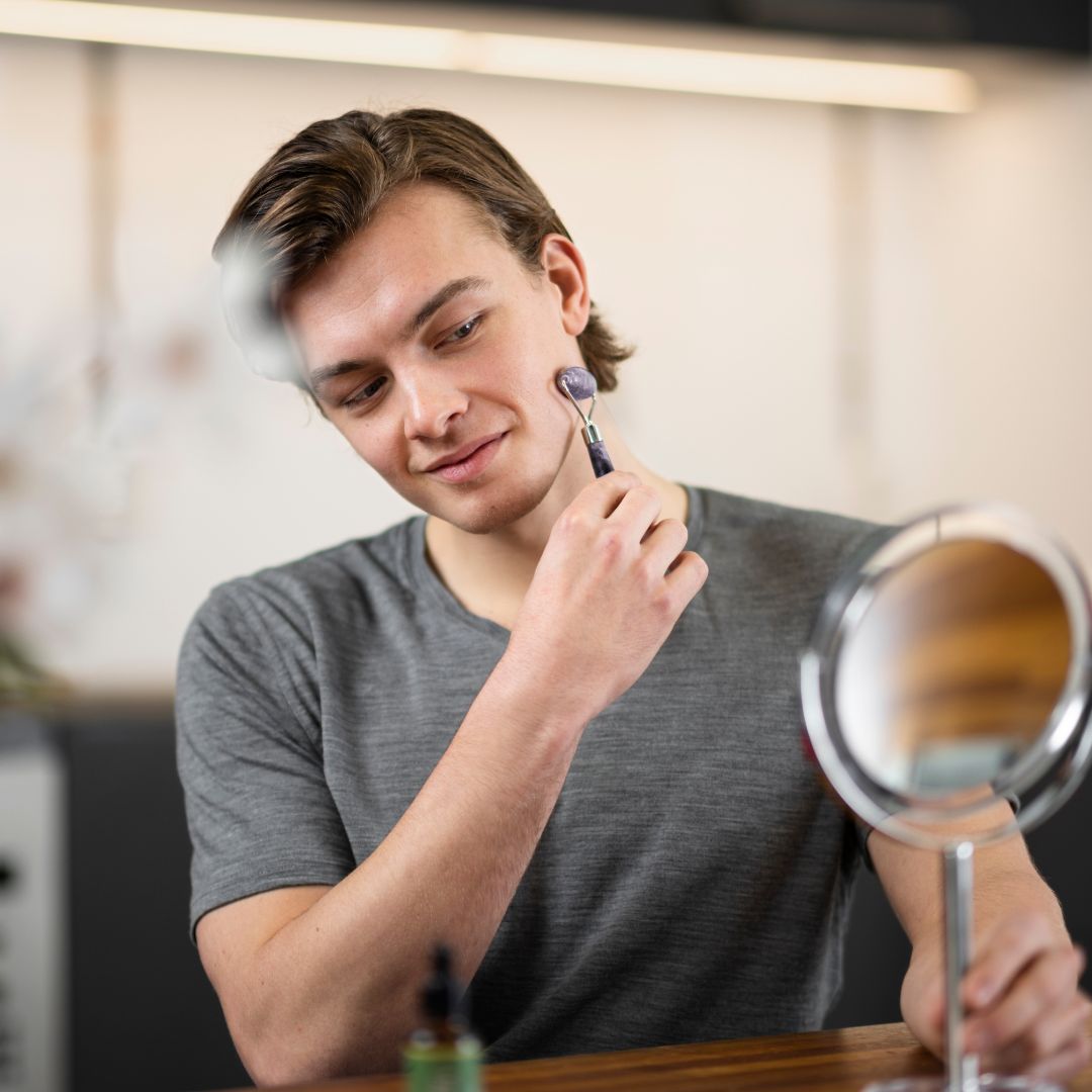 man using facial roller tool